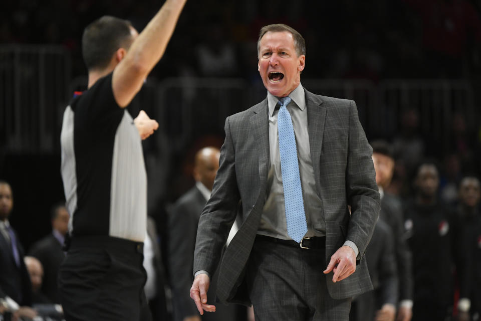 Portland Trail Blazers head coach Terry Stotts, right, shouts at referee Kane Fitzgerald before being called for a technical foul during the first half of an NBA basketball game against the Atlanta Hawks, Saturday, Feb. 29, 2020, in Atlanta. (AP Photo/John Amis)