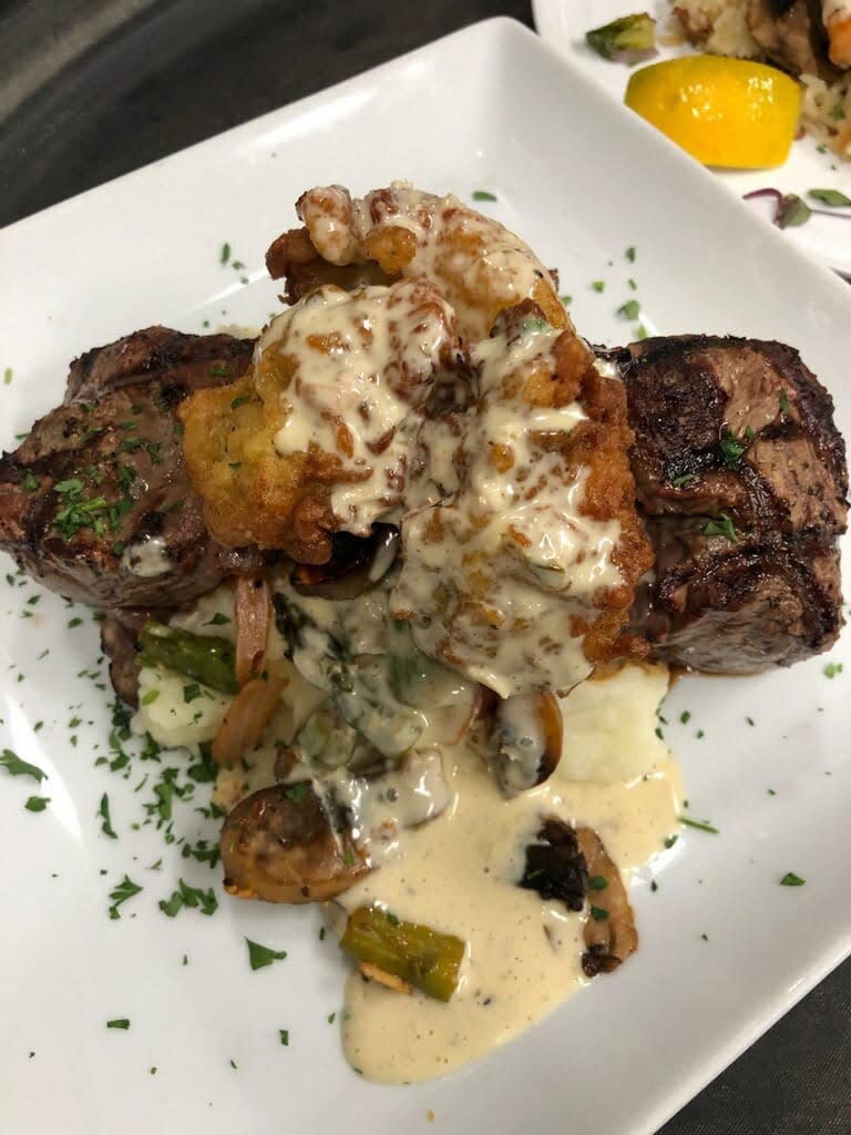 Pictured are the grilled filet tails with fried oysters over mashed potatoes with an asparagus compote and finished with a bearnaise sauce available at Da Vinci's Table in Burlington.