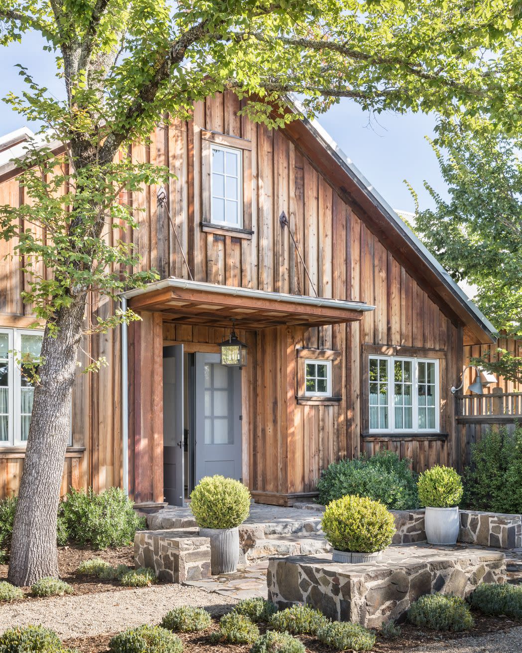 exterior of barn in sonoma, california with weathered cedar siding intact designed by victoria hagan planters chateau sonoma