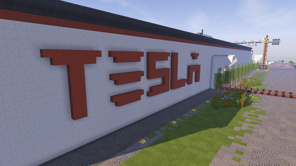 In this undated photo received on Saturday, Feb. 4, 2017 taken by Darius Kniuksta, a scene from a video game featuring a Tesla gigafactory. Lithuanians badly want Tesla Motors to build its next giant factory on their soil, so to grab the attention of the California tech company they built a virtual version of a facility inside the "Minecraft" video game. Vladas Lasas, who was behind the project, says they wanted to send a message to Tesla CEO Elon Musk that Lithuania "has plenty of skillful" people as well as a perfect factory site. (Darius Kniuksta via AP)