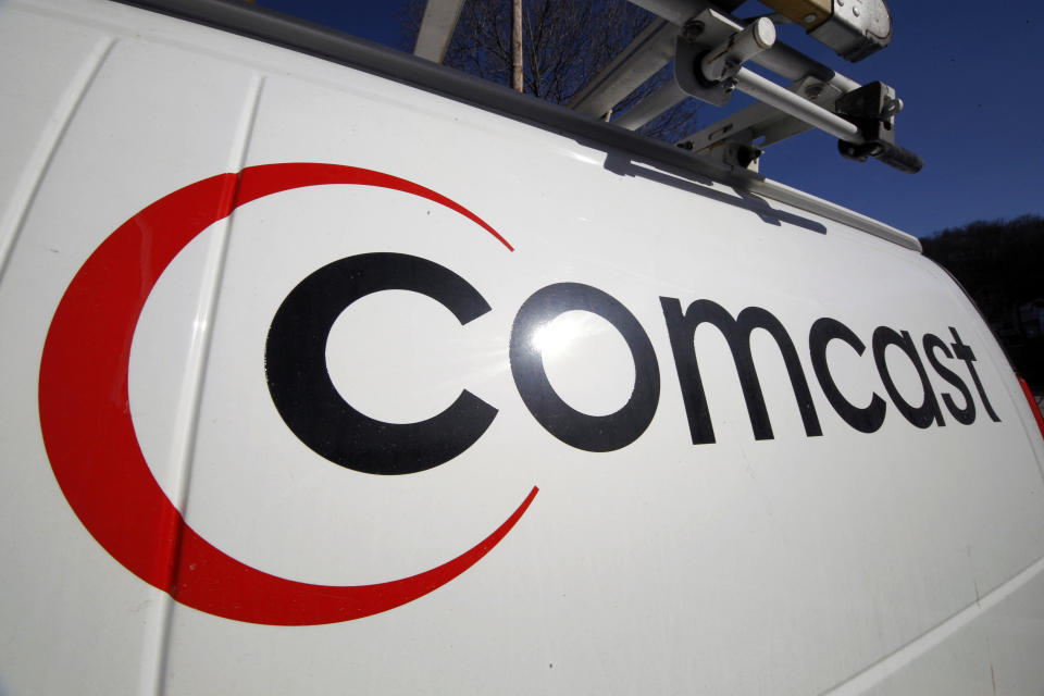 FILE - This Feb. 11, 2011 file photo shows the Comcast logo on one of the company's vehicles, in Pittsburgh. Comcast reports quarterly earnings on Tuesday, April 22, 2014. (AP Photo/Gene J. Puskar, File)