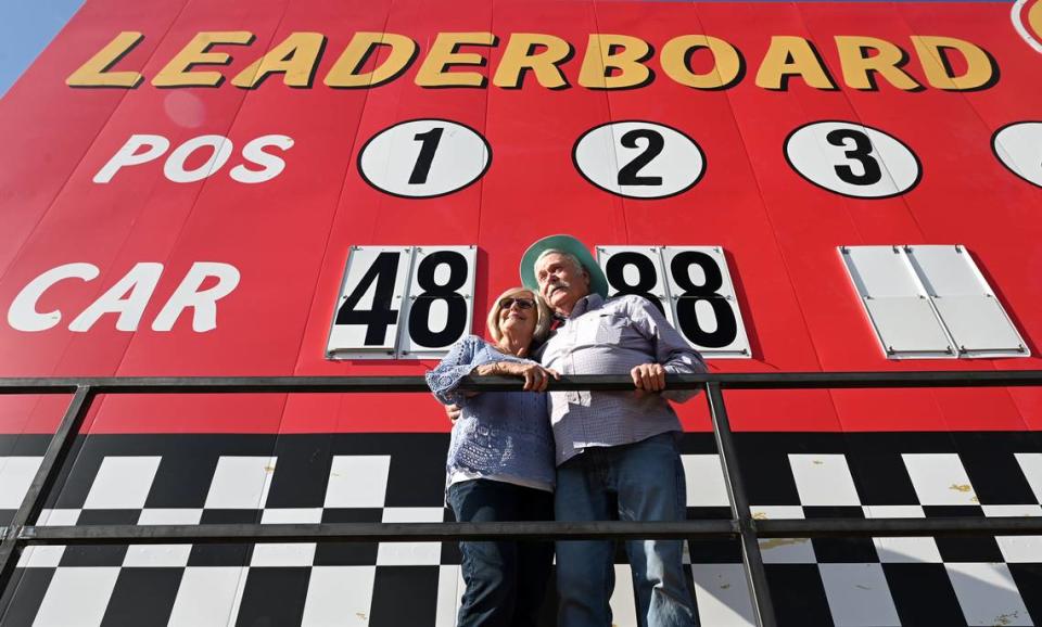 Judy and Ken Brooks stand on the leaderboard platform at North Wilkesboro Speedway on Wednesday, May 10, 2023. The speedway will host the NASCAR All-Star race on Sunday, May 21, 2023. The couple operated the manual leaderboard during the last race ran at the speedway in 1996.