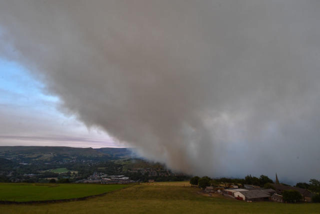 A large cloud of smoke covers the village of Mossley (Picture: Getty)