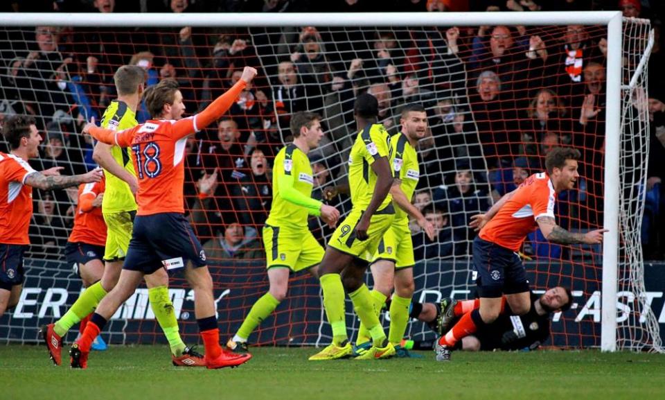 Luton Town defender Johnny Mullins, right, celebrates after scoring.