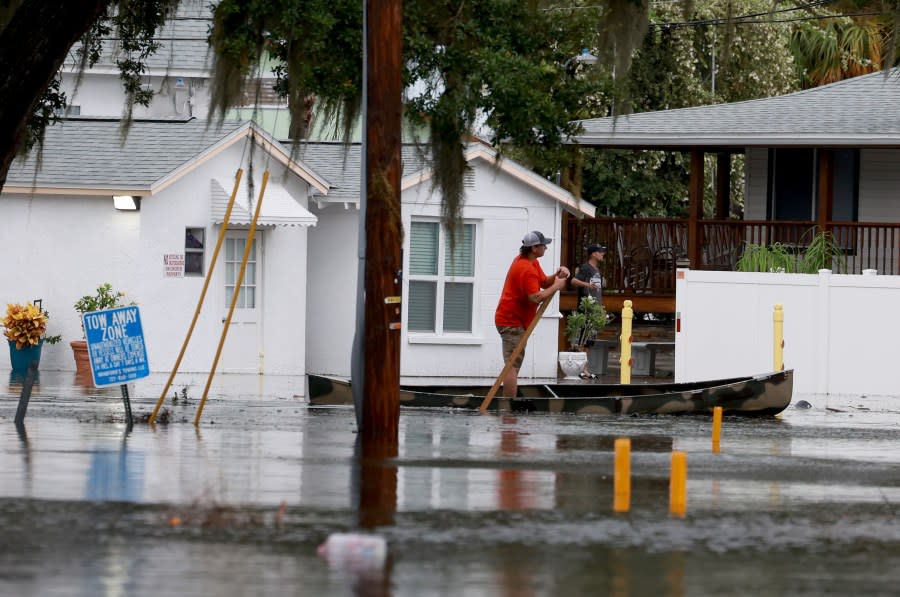 A person canoes through the flooded streets caused by Hurricane Idalia passing offshore on August 30, 2023 in Tarpon Springs, Florida. Hurricane Idalia is hitting the Big Bend area on the Gulf Coast of Florida. (Photo by Joe Raedle/Getty Images)