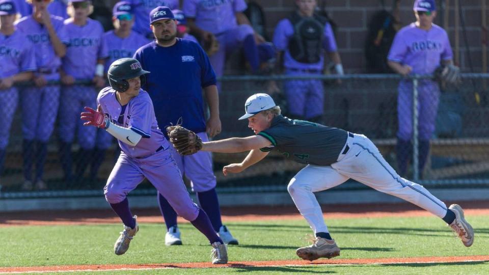 Mountain View third baseman Ryan Yesford chases down a Rocky Mountain base runner in the semifinals of the 5A baseball state tournament May 17. 