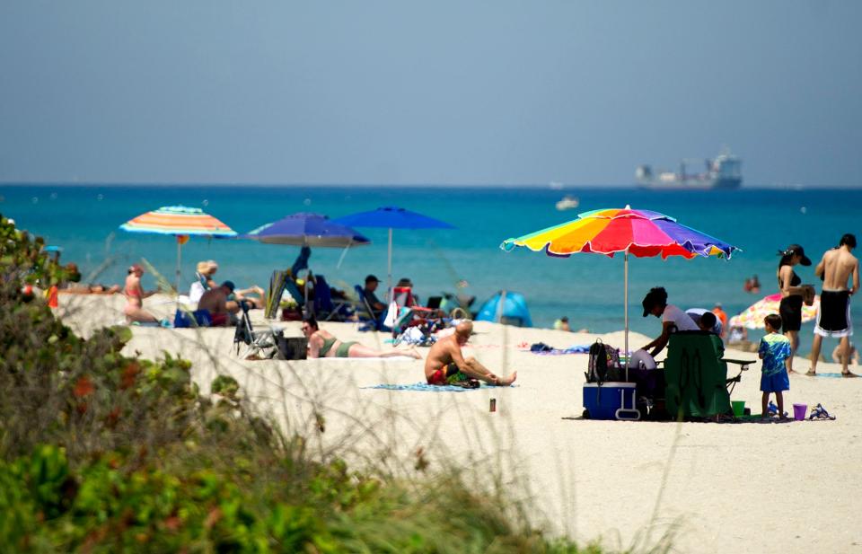 Midtown Beach is busy with sunbathers and swimmers May 5, 2022 in Palm Beach.