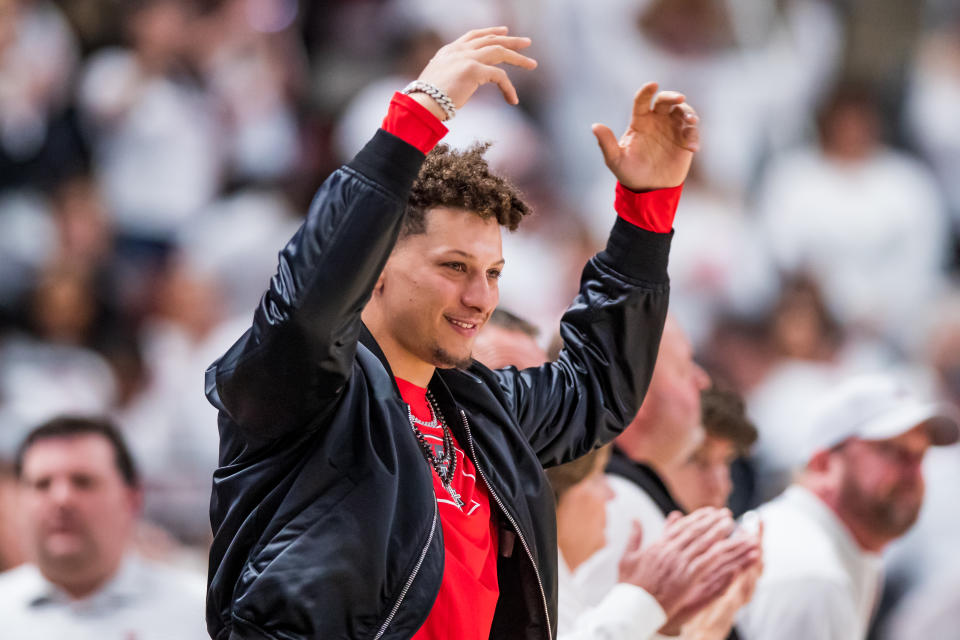 LUBBOCK, TEXAS - FEBRUARY 16: Quarterback Patrick Mahomes of the Kansas City Chiefs cheers during the first half of the college basketball game between the Texas Tech Red Raiders and the Baylor Bears at United Supermarkets Arena on February 16, 2022 in Lubbock, Texas. (Photo by John E. Moore III/Getty Images)