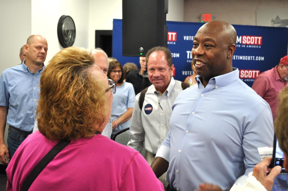 GOP presidential candidate South Carolina Senator Tim Scott talks on-on-one with voters after a town hall in Le Mars, Iowa. Scott took 15 questions from the crowd and press and then stayed after to meet voters.