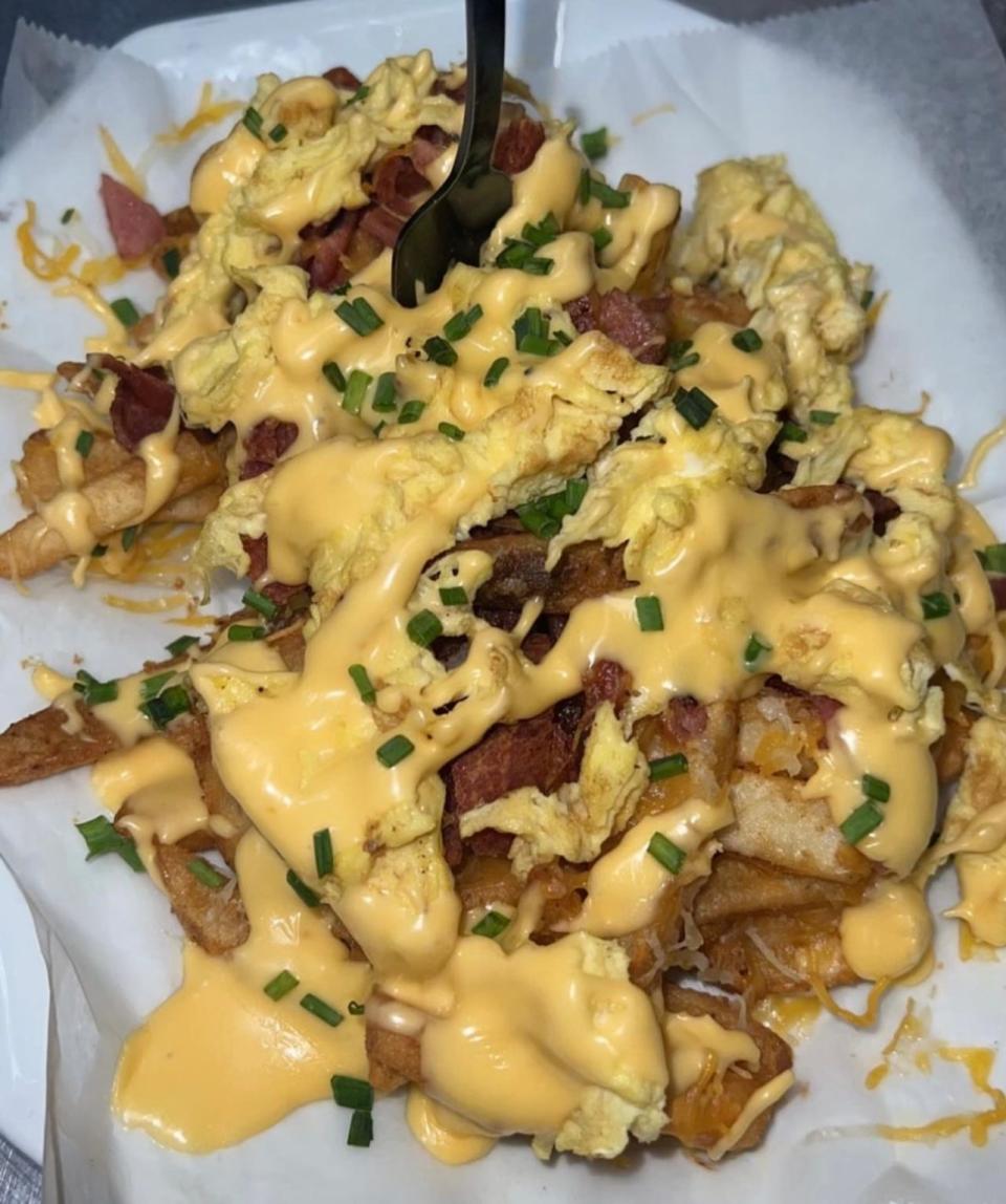 Breakfast fries topped with bacon, scrambled eggs, cheese and chives from Elli's Backyard in Red Bank.