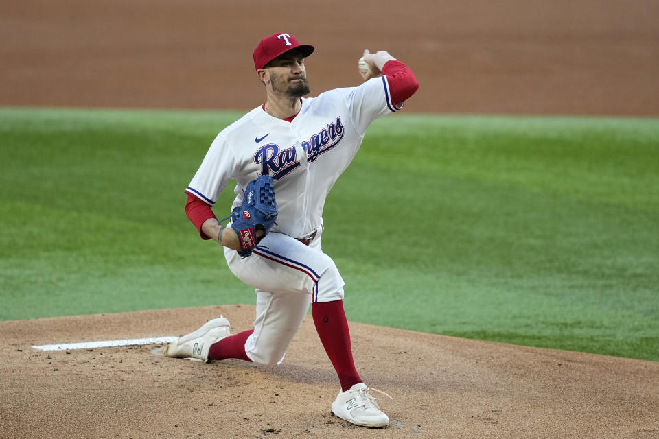 Texas Rangers starting pitcher Andrew Heaney throws to the Kansas City Royals in the first inning of a baseball game, April 10, 2023, in Arlington, Texas. (AP Photo/Tony Gutierrez)
