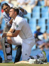 South Africa's batsman Ryan McLaren, front, is attended by an unidentified medic after being struck by a ball close to his right ear, from Australia's bowler Mitchell Johnson, on the fourth day of their their cricket test match at Centurion Park in Pretoria, South Africa, Saturday, Feb. 15, 2014. (AP Photo/ Themba Hadebe)