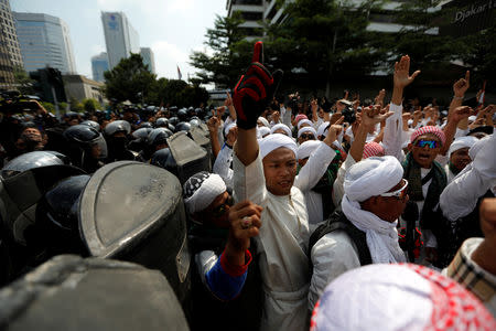 Protesters shout during a protest near the Election Supervisory Agency (Bawaslu) headquarters following the announcement of the last month's presidential election results in Jakarta, Indonesia, May 22, 2019. REUTERS/Willy Kurniawan