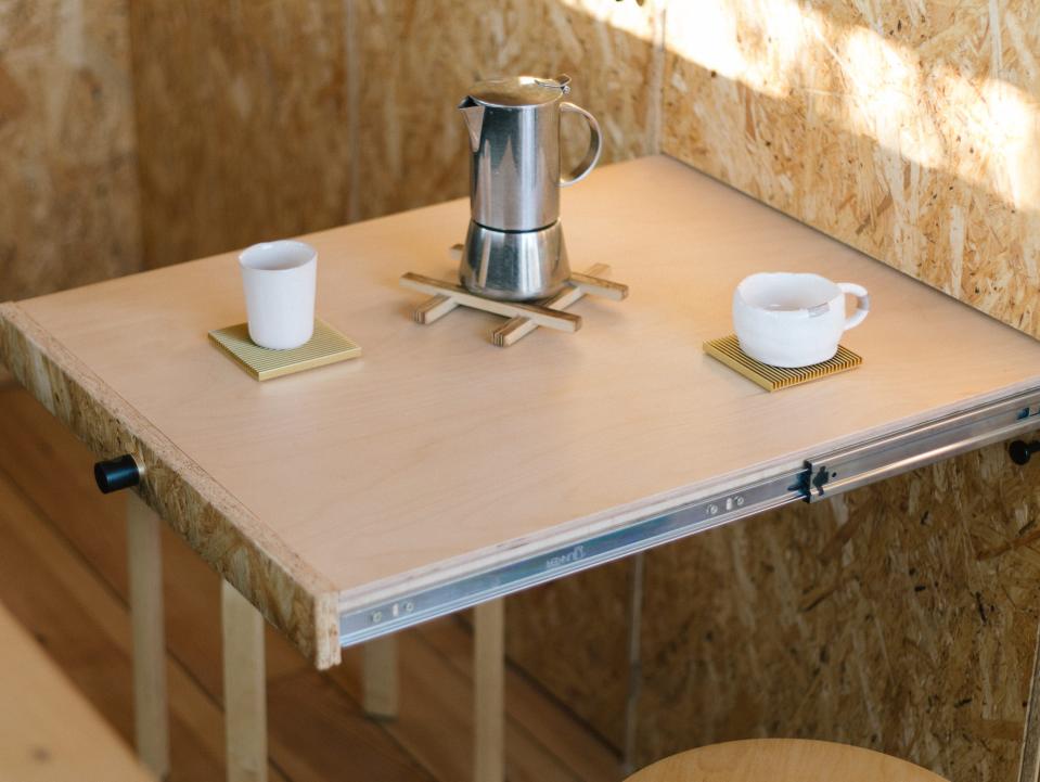 A retractable dining table that can be kept in the wall when not in used.