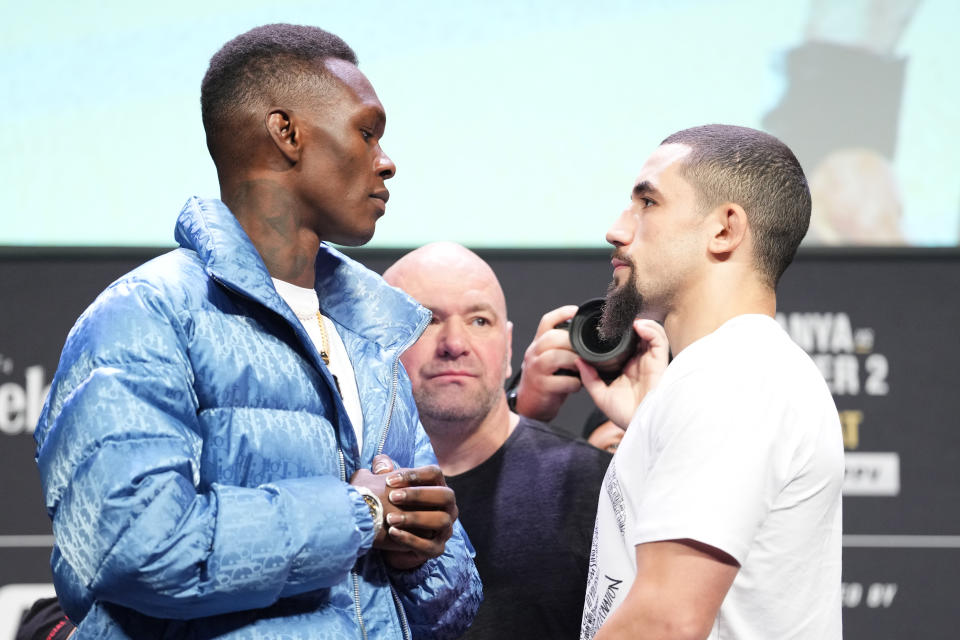 Opponents Israel Adesanya (pictured left) and Robert Whittaker (pictured right) face off during the UFC 271 press conference.