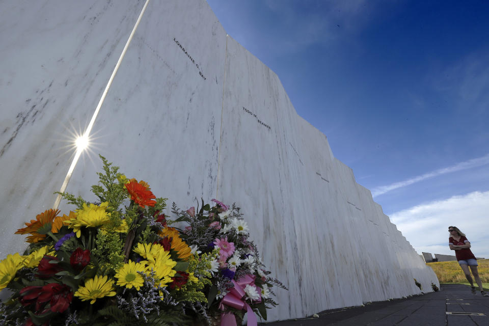 A visitor to the Flight 93 National Memorial in Shanksville, Pa., views the Wall of Names on Tuesday, Sept. 10, 2019, as the nation prepares to mark the 18th anniversary of the Sept. 11, 2001 attacks. (AP Photo/Gene J. Puskar)