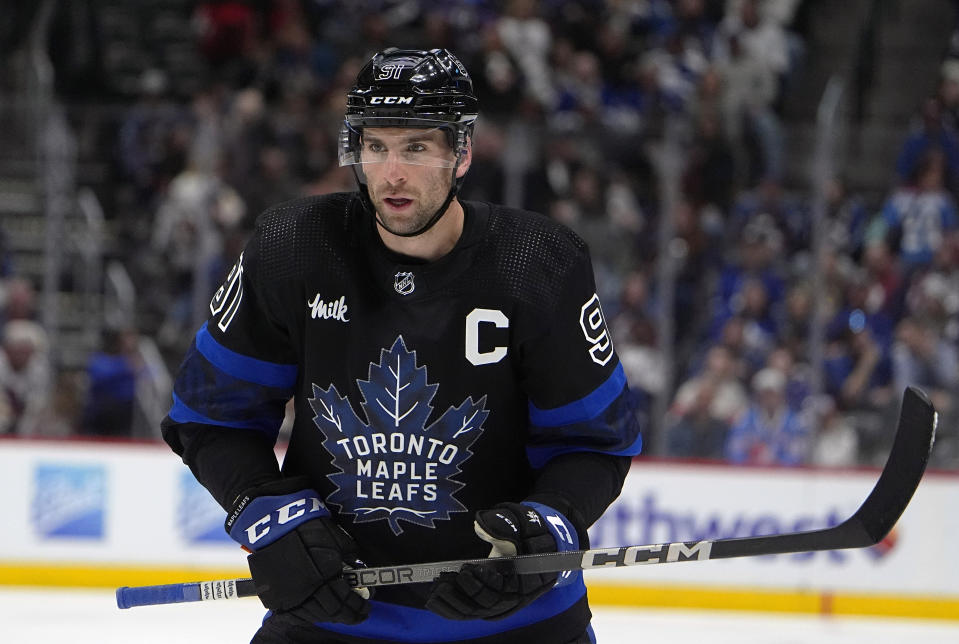 Toronto Maple Leafs center John Tavares waits for a face off in the second period of an NHL hockey game against the Colorado Avalanche Saturday, Feb. 24, 2024, in Denver. (AP Photo/David Zalubowski)