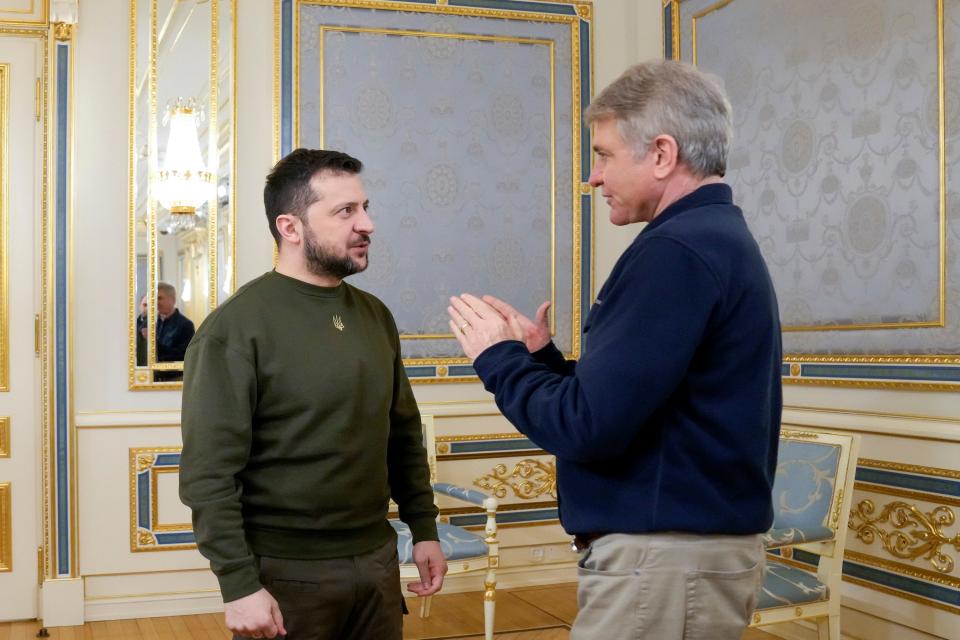 Rep. Michael McCaul, R-Texas, talks with Ukrainian President Volodymyr Zelenskyy on Feb. 21 in Kyiv, Ukraine.