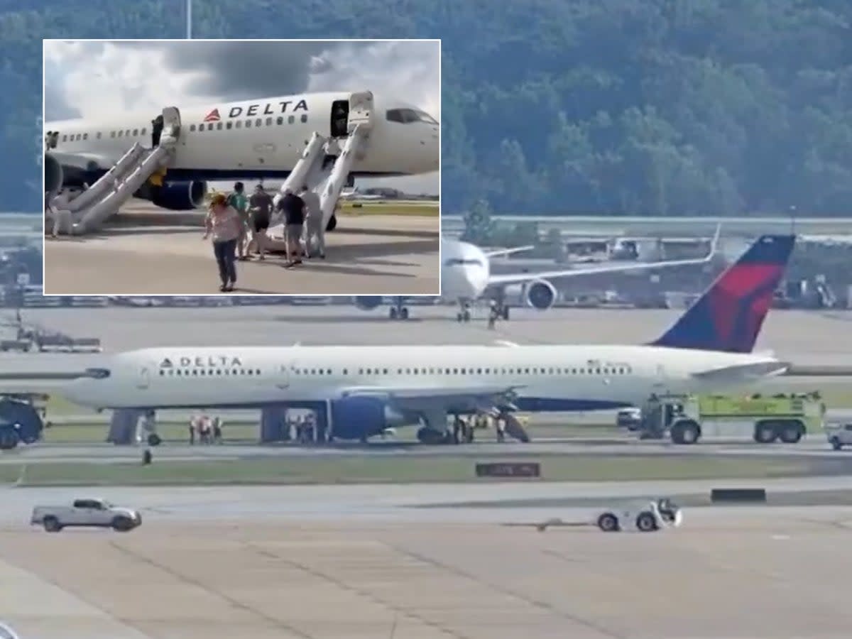 Passengers evacuating the plane after landing in Atlanta  (Mike Russell/FlightMode/FOX 5 Atlanta)