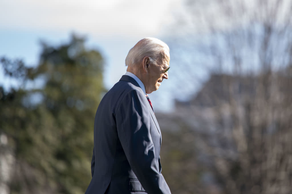  Biden walks on the South Lawn of the White House before boarding Marine One. 