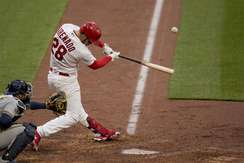 St. Louis Cardinals' Nolan Arenado hits a two-run home run during the eighth inning of a baseball game against the Milwaukee Brewers Thursday, April 8, 2021, in St. Louis. (AP Photo/Jeff Roberson)