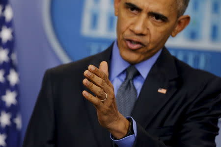 U.S. President Barack Obama gestures as he holds his end of the year news conference at the White House in Washington, December 18, 2015. REUTERS/Carlos Barria