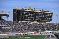 FILE - In this Feb. 24, 2019, file photo, a NASCAR Monster Energy NASCAR Cup Series auto race starts at Atlanta Motor Speedway in Hampton, Ga. NASCAR and IndyCar have each called off their races this weekend. NASCAR was scheduled to run Sunday at Atlanta Motor Speedway without spectators but said Friday, March 13, 2020, it is calling off this weekend and next week’s race at Homestead-Miami Speedway. IndyCar was scheduled to open its season Sunday on the streets of St. Petersburg, Florida, but suspended it’s season through the end of April.(AP Photo/Scott Cunningham, File)