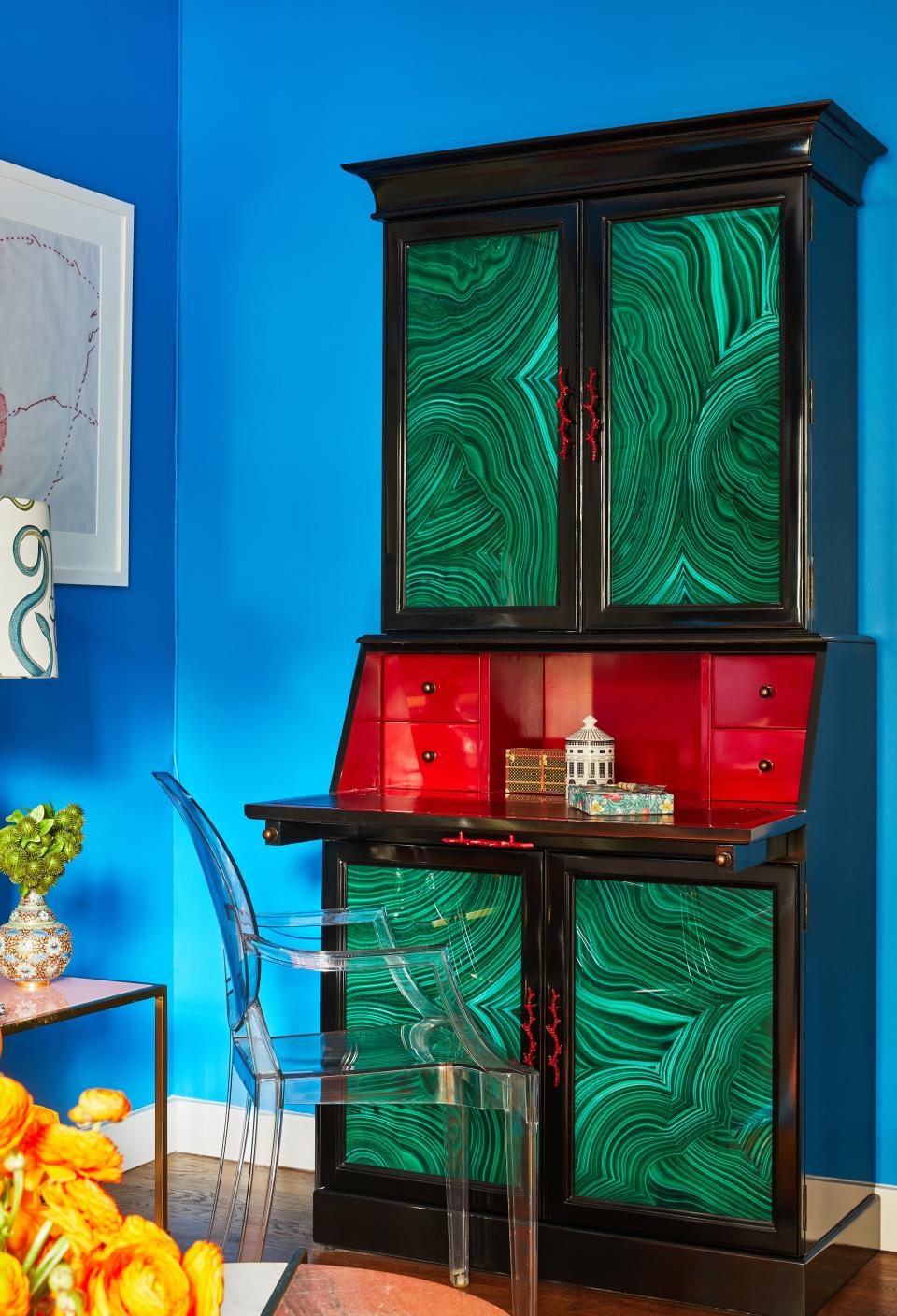 Courtney fell in love with this malachite secretary desk from Currey and Company after spotting it in their showroom. Given her apartment’s small footprint, each piece has to serve a function. In the case of this armoire, Courtney uses it as her linen closet.