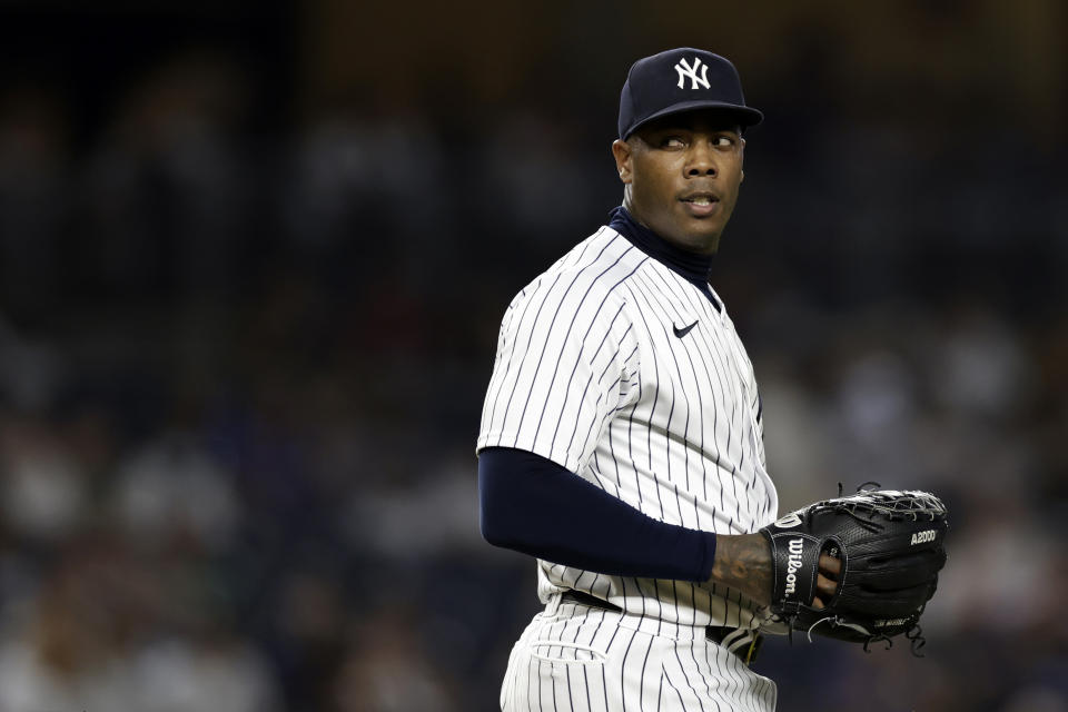 New York Yankees pitcher Aroldis Chapman (54) reacts during the ninth inning of the team's baseball game against the Toronto Blue Jays on Friday, Aug. 19, 2022, in New York. The Blue Jays won 4-0. (AP Photo/Adam Hunger)