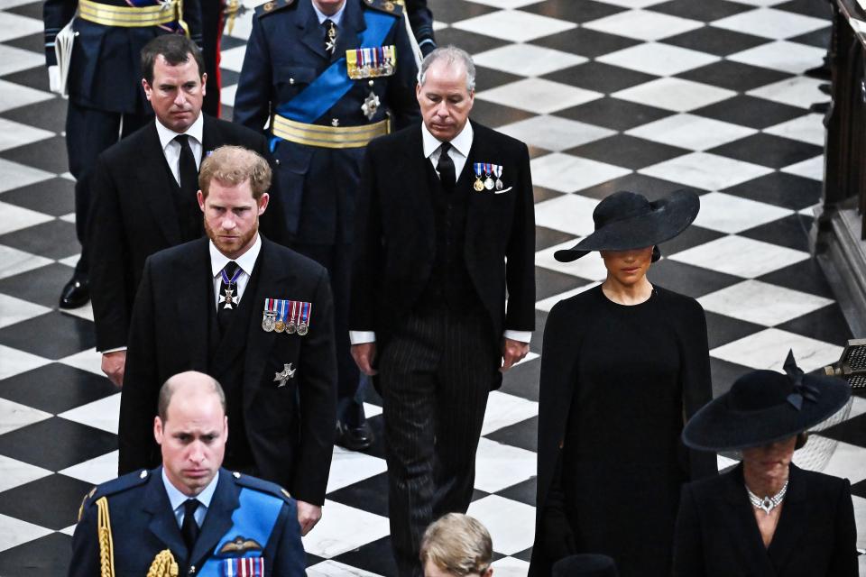 Peter Phillips and Prince Harry, Duke of Sussex, leave the Abbey.