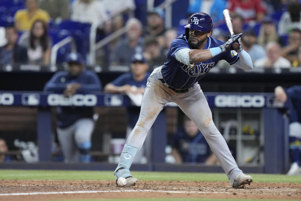 Tampa Bay Rays' Vidal Brujan is hit in the foot by a pitch during the sixth inning of a baseball game against the Miami Marlins, Tuesday, Aug. 29, 2023, in Miami. (AP Photo/Wilfredo Lee)