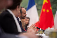 France's Prime Minister Edouard Philippe listens as China's President Xi Jinping (not pictured) speaks during a meeting at the Great Hall of the People in Beijing, China June 25, 2018. Fred Dufour/Pool via REUTERS