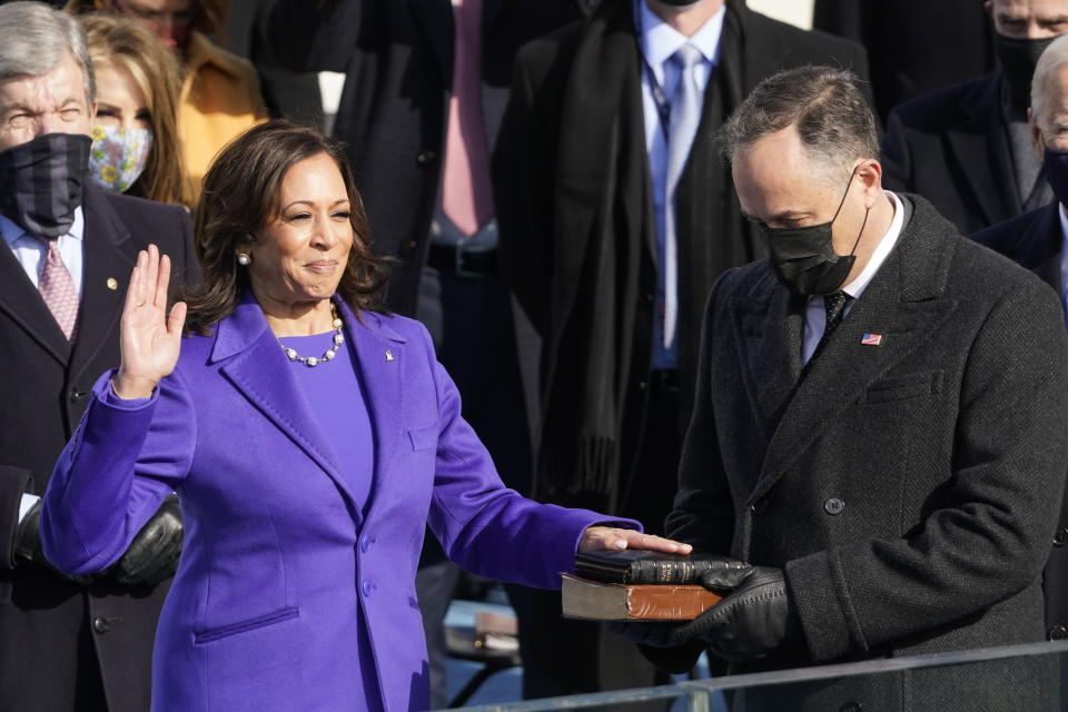 Kamala Harris is sworn in as vice president by Supreme Court Justice Sonia Sotomayor as her husband Doug Emhoff holds the Bible during the 59th Presidential Inauguration at the U.S. Capitol in Washington, Wednesday, Jan. 20, 2021. (AP Photo/Andrew Harnik)