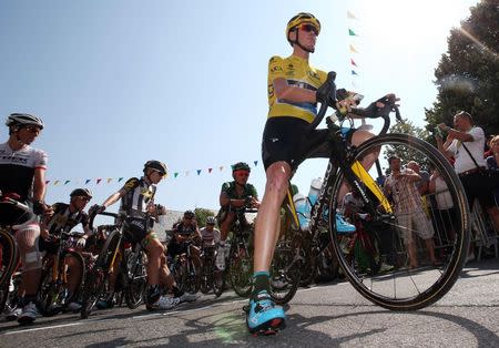 Team Sky rider Chris Froome of Britain waits for the start of the 195-km (121.2 miles) 12th stage of the 102nd Tour de France cycling race from Lannemezan to Plateau de Beille in the French Pyrenees mountains, France, July 16, 2015. REUTERS/Stefano Rellandini