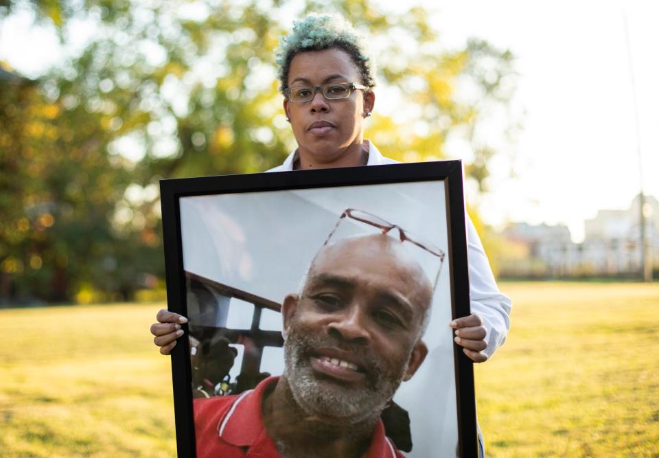 Jada McDaniel holds a portrait of her brother, Michael McDaniel, who died Feb. 6, 2021 after a violent clash with guards at the Correctional Reception Center. 