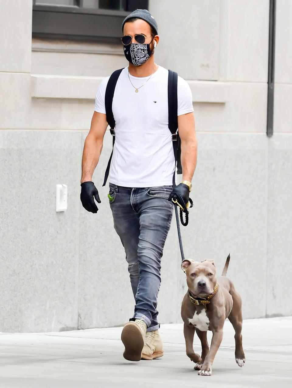 <p>Justin Theroux takes his dog out for a walk in N.Y.C. on Saturday. </p>