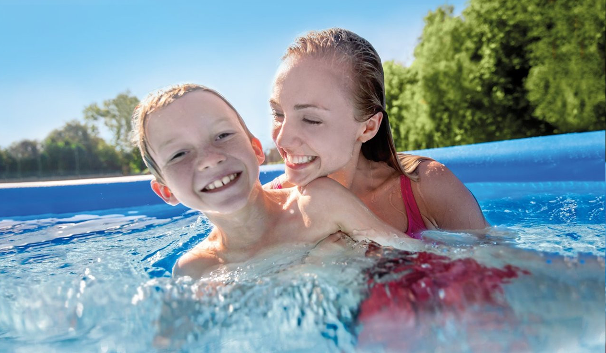 Image of woman and child laughing in inflatable Intex pool