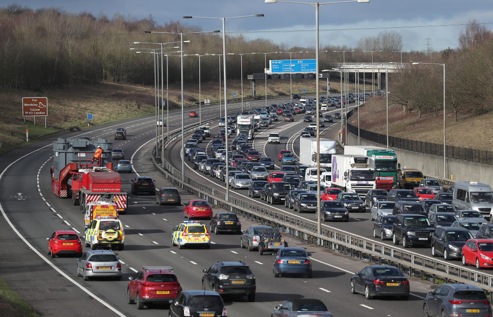 An abnormal load is escorted along the M25 near to Iver as it makes it's way towards Uxbridge.