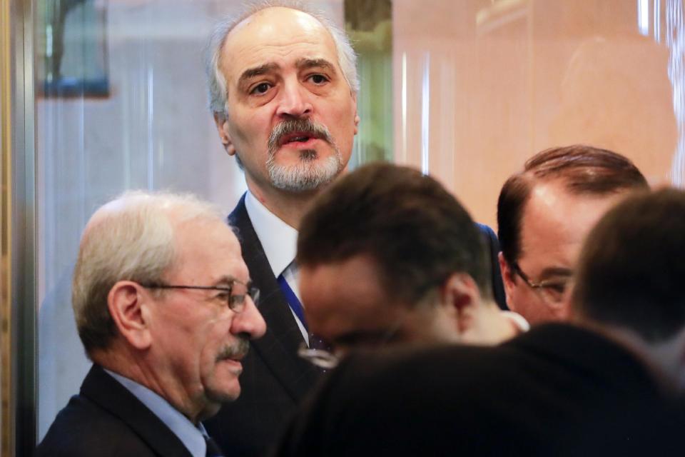 Bashar Jaafari, top, Syrian ambassador to the U.N. and head of a Syrian delegation, prepares to attend talks on Syrian peace at a hotel in Astana, Kazakhstan, Monday, Jan. 23, 2017. The talks are the latest attempt to forge a political settlement to end a war that has by most estimates killed more than 400,000 people since March 2011 and displaced more than half the country's population. (AP Photo/Sergei Grits)