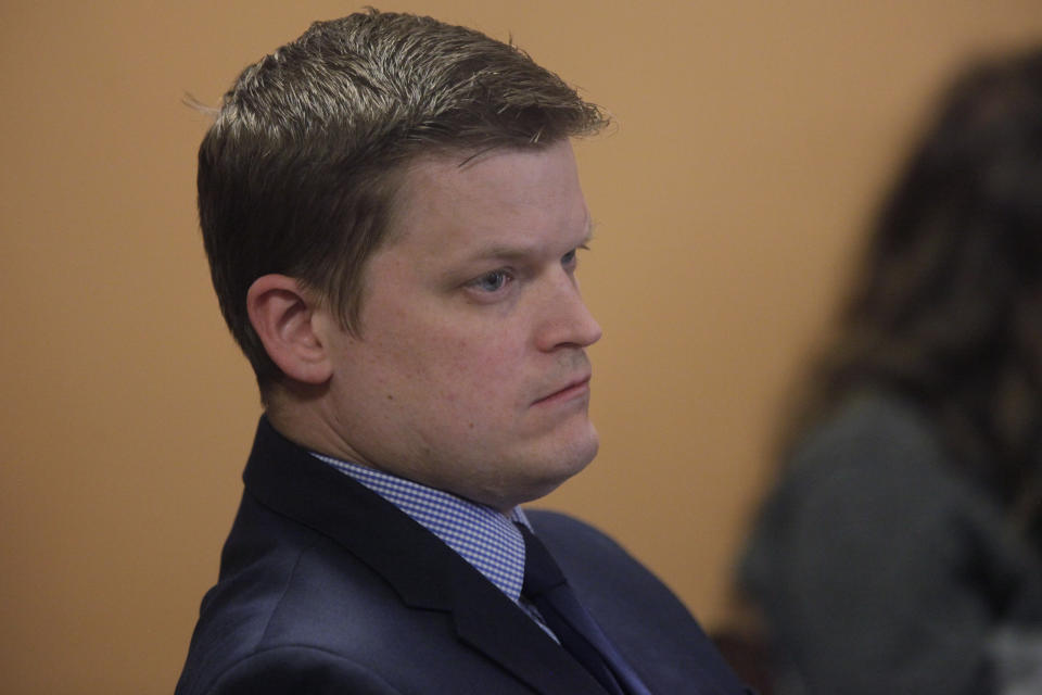 Mark Skoglund, the Kansas Governmental Ethics Commission's executive director, follows a House committee hearing as members discuss a bill to overhaul the commission and rewrite campaign finance laws, Tuesday, Feb. 21, 2023, at the Statehouse in Topeka, Kan. The commission has been investigating Republican campaign practices for at least a year. (AP Photo/John Hanna)