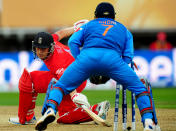 England's Jonathan Trott is stumped by Mahendra Dhoni for 20 during the ICC Champions Trophy Final at Edgbaston, Birmingham.