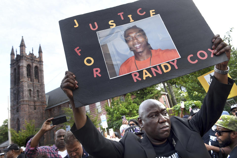 FILE - Civil rights attorney Benjamin Crump takes part in a march for Justice for Richard "Randy" Cox from the Stetson Library to the New Haven Police Department on July 8, 2022, in New Haven, Conn. Five Connecticut police officers were charged with misdemeanors Monday, Nov. 28, over their treatment of Cox after he was paralyzed from the chest down in the back of a police van. (Arnold Gold/New Haven Register via AP, File)