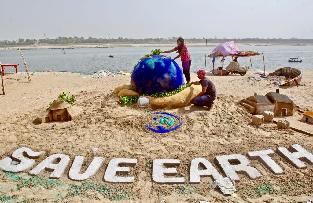 Earth Day 2018 sand sculpture on the banks of the river Yamuna in Allahabad, India.