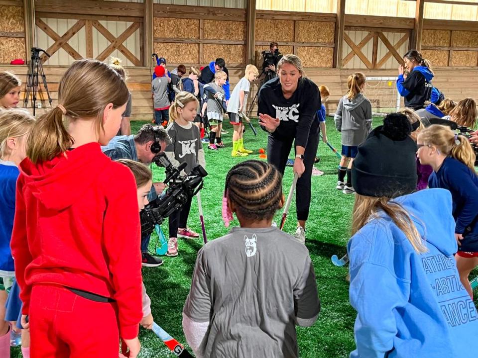 Kylie Kelce runs drills with kids attending a field hockey clinic she hosted with Stick With KC Sunday ahead of the Chiefs-Eagles game Monday. Kelce started playing field hockey in second grade.