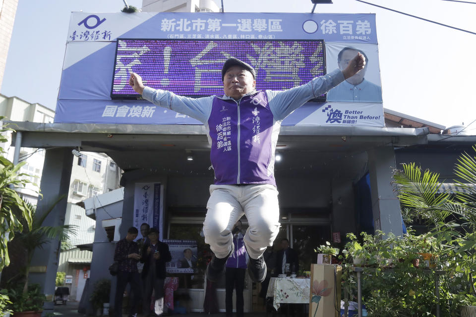 Chui Pak-tai, a Taiwanese of Hong Kong descent, poses for the media in front of his campaign headquarters in New Taipei City, Taiwan, on Dec. 8, 2023. At 72, Chui, a former Hong Kong pro-democracy district councilor who secured Taiwan residency 11 years ago, is running for legislative office. Although he faces long odds, his campaign draws attention to the immigration challenges of the Hong Kong diaspora.(AP Photo/Chiang Ying-ying)