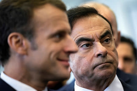 FILE PHOTO: French President Emmanuel Macron and Renault CEO Carlos Ghosn visit the Renault factory in Maubeuge, France, November 8, 2018. Etienne Laurent/Pool via REUTERS/File Photo