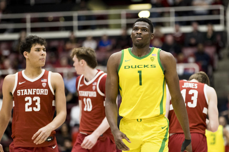 Oregon center N'Faly Dante (1) and Stanford forward Brandon Angel (23) react during the second half of an NCAA college basketball game in Stanford, Calif., Saturday, Jan. 21, 2023. Stanford won 71-64. (AP Photo/John Hefti)