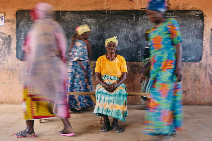 Sugri Zenabu, a mangazia (female community leader) of the Gambaga &quot;witch camp&quot;, sits encircled by residents in Gambaga, Ghana, 27 October 2022