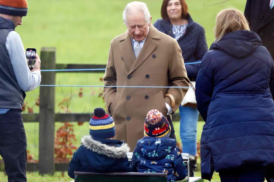 <p>Max Mumby/Indigo/Getty</p> King Charles chats with the Ward family as he attends the Sunday service at St Mary Magdalene on Jan. 7.