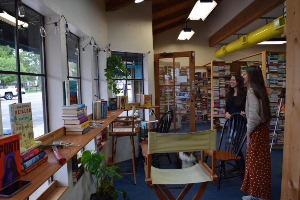 Best friends Carla Cary and Clio Bruns bought Spare Time Books in Paso Robles in April 2023. In June, the pair were fixing up the shop, including transforming the front window into a seating area and book display. Kaytlyn Leslie/kleslie@thetribunenews.com